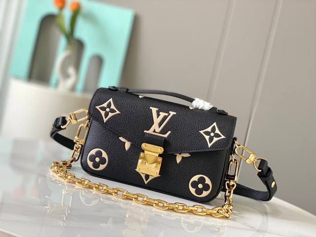 Overseas original 46595 printed two colors. This Pochette M