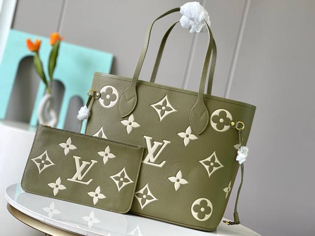 Top original 46649 This Neverfull medium handbag is made of Monogram Empreinte g