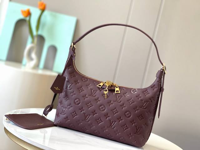 Top original 46610 This Sac Sport handbag uses soft Monogram Empreinte embossed