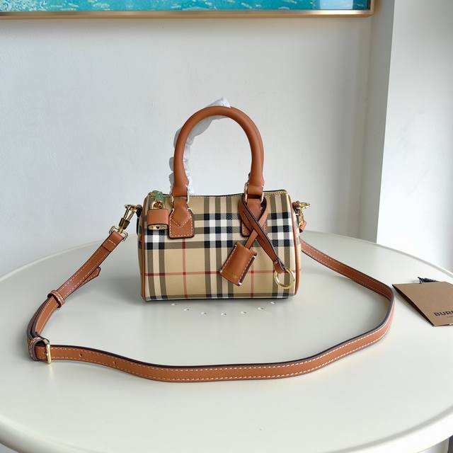 Burberry stand-up design with Burberry check, leather-wrapped padlock and luggag