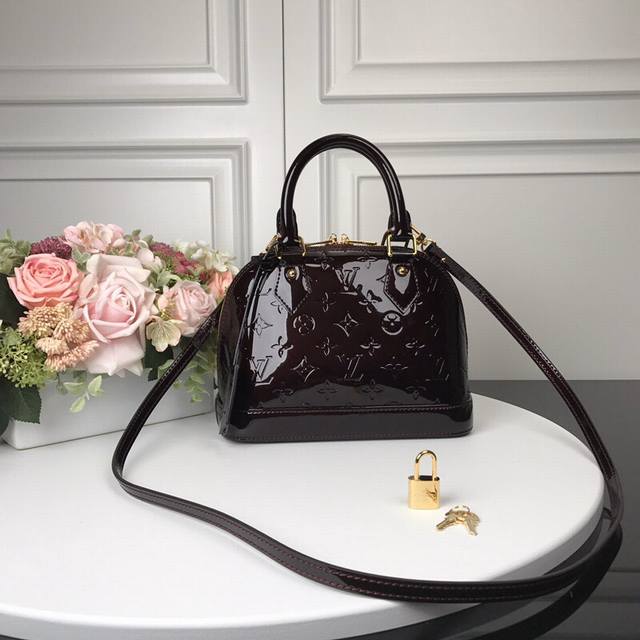 M91606 Coffee Top Original Alma Bb Handbag The lovely Alma Bb handbag is based o