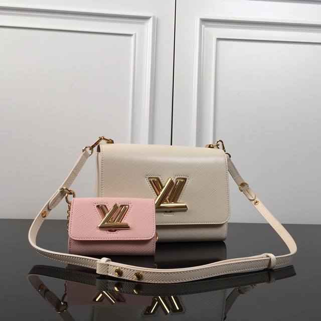M59885 Beige with pink top original This Twist medium handbag uses the iconic Ep