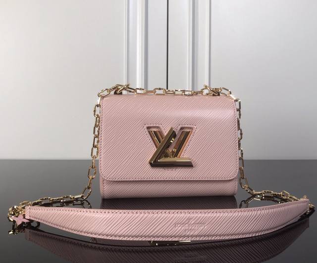 M21027 Pink ribbed lock top original This small Twist handbag is made of Epi lea
