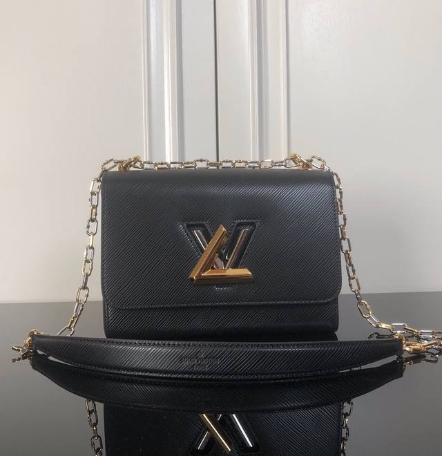 M21025 Black ribbed lock top original This Twist medium handbag is made of Epi g