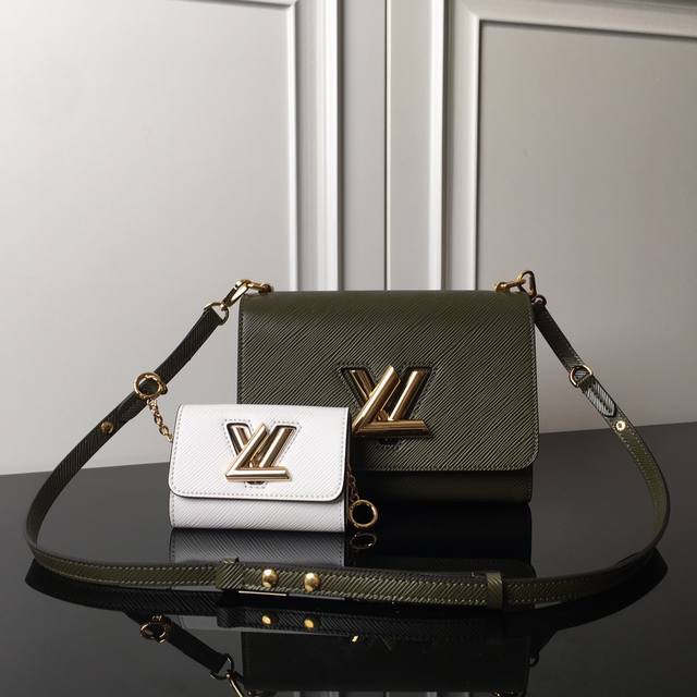 M59885 Green with white top original This Twist medium handbag uses the iconic E
