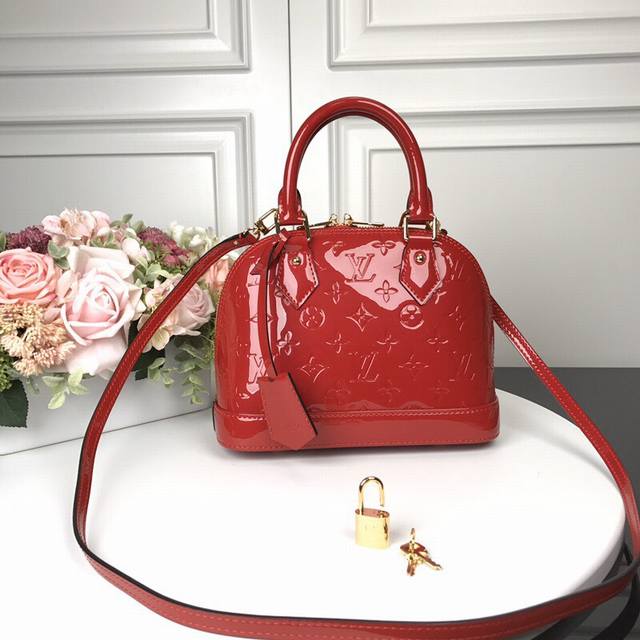 M91606 Red Top Original Alma Bb Handbag The lovely Alma Bb handbag is based on a