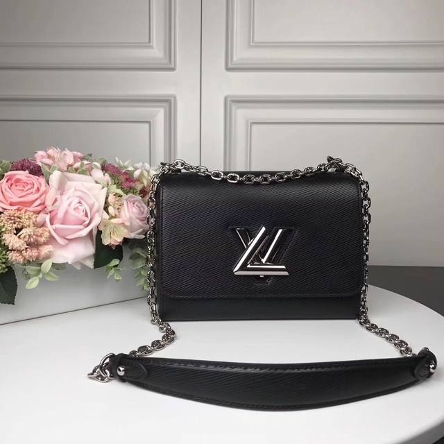 M50280g Top original Twist Medium Handbag This chic small handbag hides a secret