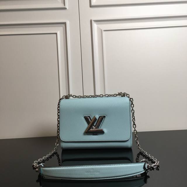 M50280 Mint Green Top Original Twist Medium Handbag This chic small handbag hide