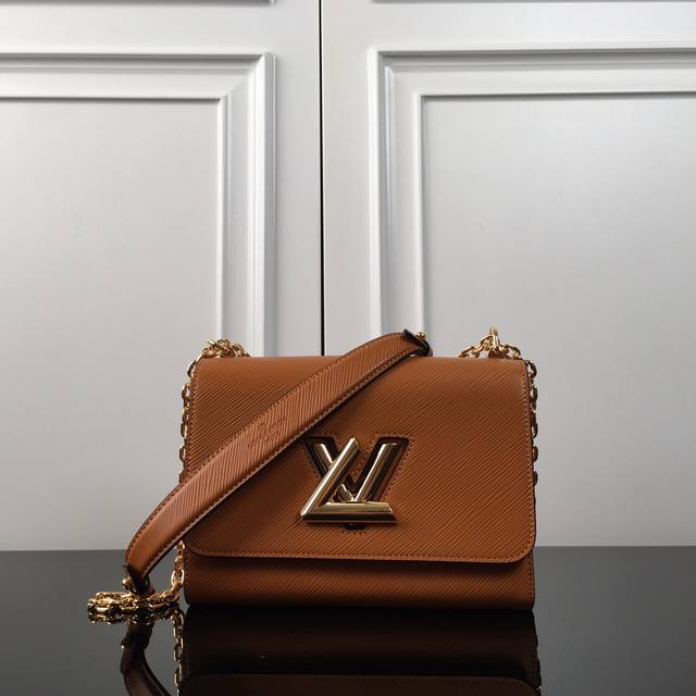 M50280 Brown top original Twist medium chain bag announces the neoclassical styl
