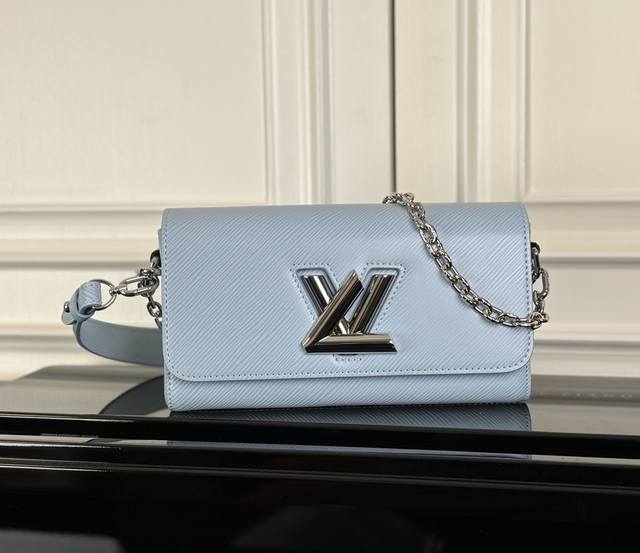 M24549 Blue Original This Twist West bag features an elegant, slender shape, a s