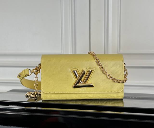 M24549 Yellow Top Original This Twist West bag features an elegant, slender shap