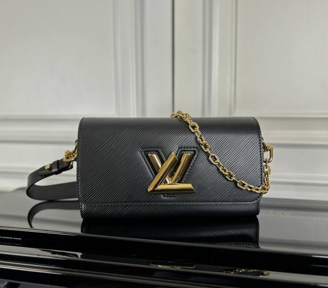 M24549 Black Original This Twist West bag features an elegant, slender shape, a