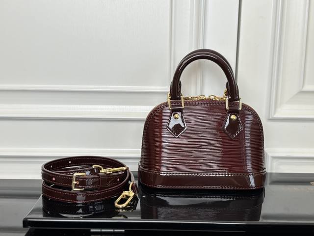 M81945 Mirrored Burgundy Top Original The Nano Alma is a miniature version of Lo