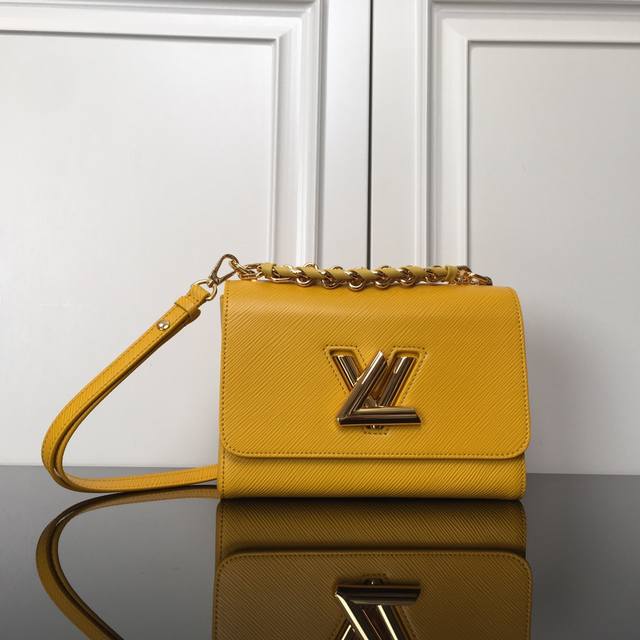 M59887 Yellow Top Original This Twist Medium Handbag is made of dark-dyed Epi gr