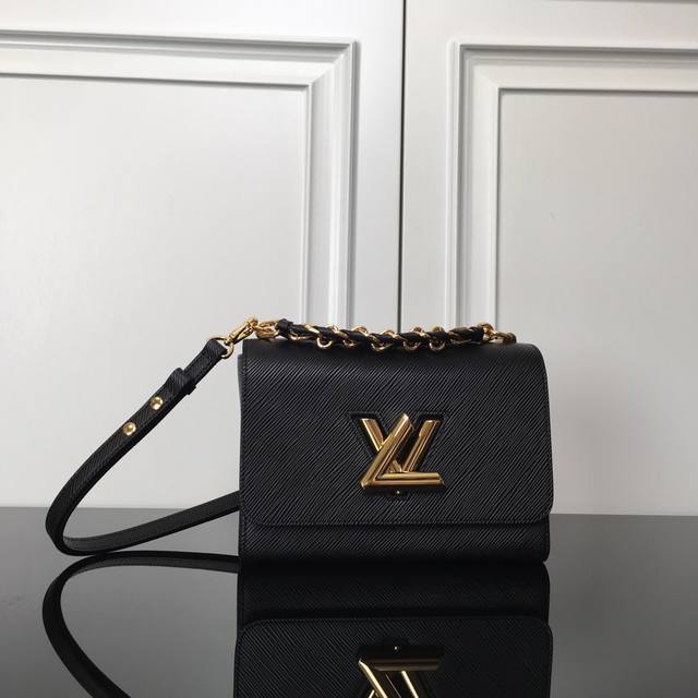M59887 Black Top Original This Twist Medium Handbag is made of dark-dyed Epi gra