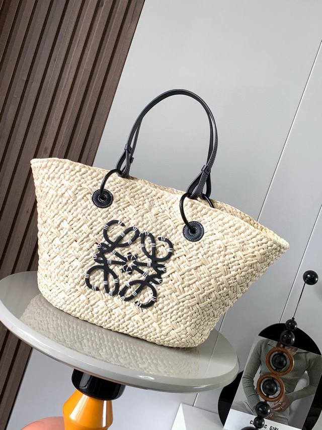 Large Iraca Palm Fiber and Cow Leather Anagram Basket Handbags. Many celebrities
