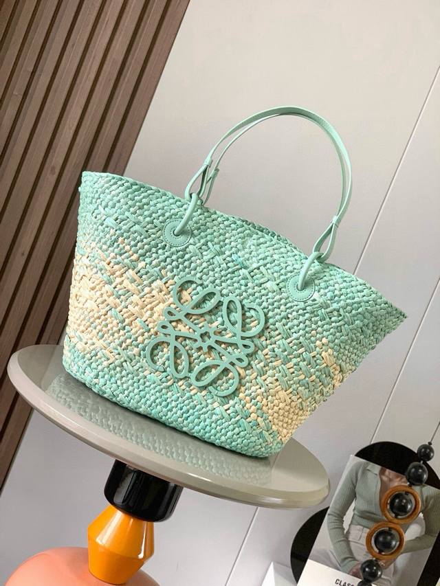 Large Iraca Palm Fiber and Cow Leather Anagram Basket Handbags. Many celebrities
