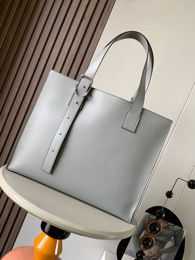 Loewe classic cowhide Buckle Horizontal tote is a slim and lightweight handbag w