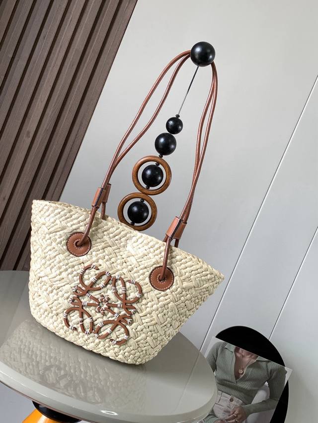 Small Iraca Palm Fiber and Cow Leather Anagram Basket Handbags. Many celebrities