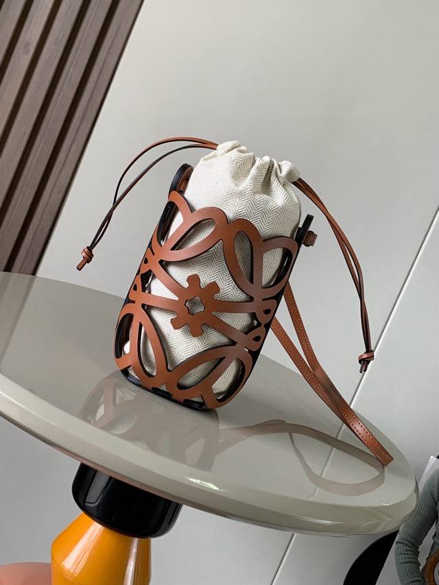 Classic cowhide and canvas Anagram hollow pouch This versatile crossbody pouch i