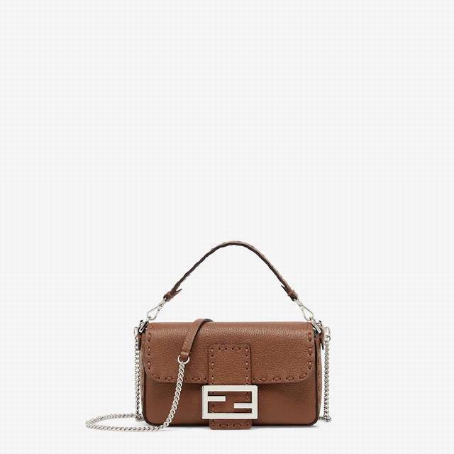 Baguette mini handbag, hand-sewn with 309 large-scale visible stitches in the sa