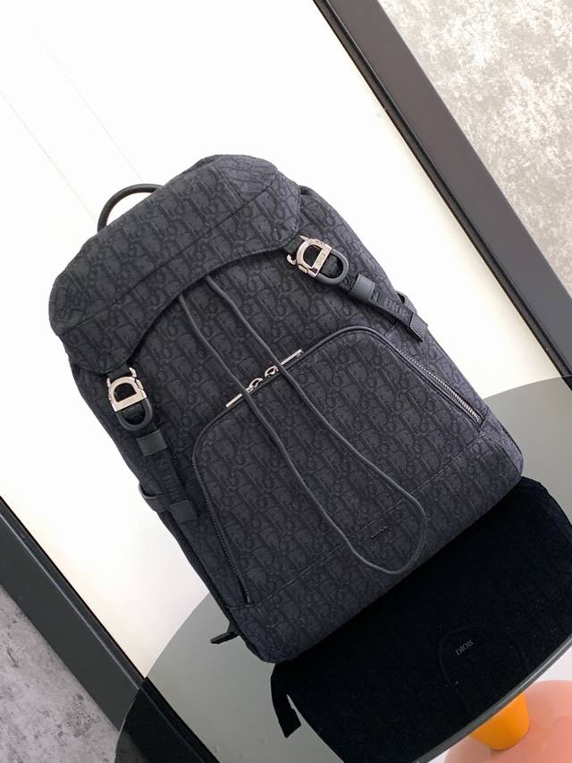 New to the Summer 2024 Men's collection, this Dior 8 backpack with flap pays hom