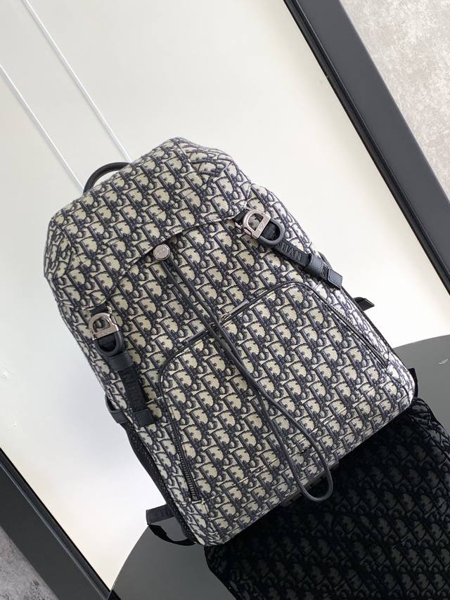New to the Summer 2024 Men's collection, this Dior 8 backpack with flap pays hom
