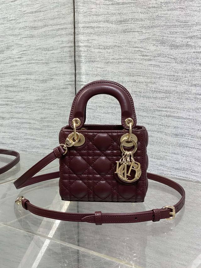 Burgundy in stock Lady's latest Micro series, a bag that can't hold anything but