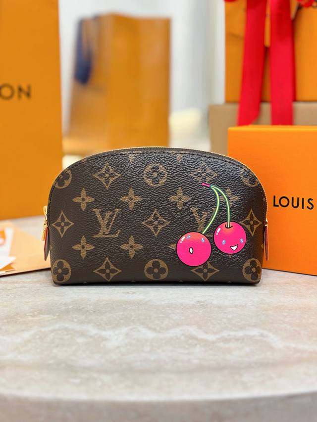 X Tm Small Cosmetic Bag M13766 This small cosmetic bag is from the Louis Vuitton