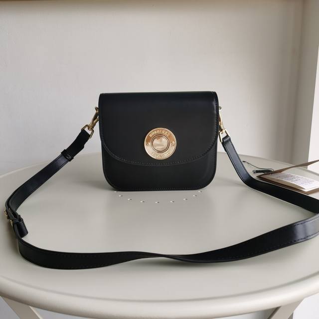 Burberry's slim, preppy crossbody bag is crafted in oversized check and topstitc