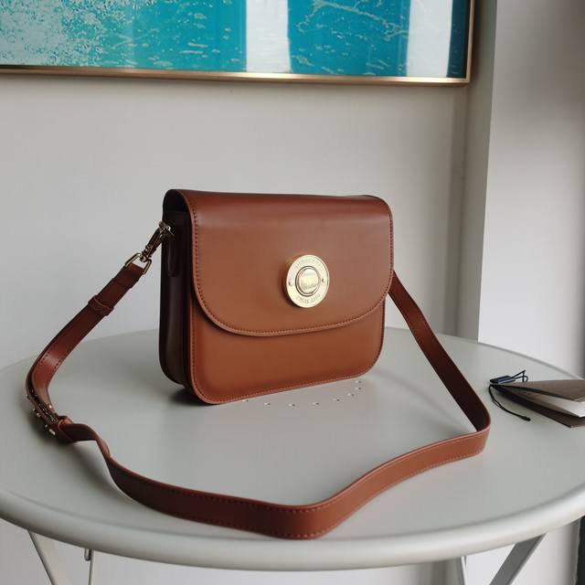 Burberry's structured, preppy crossbody bag in Italian tanned leather. Front pan
