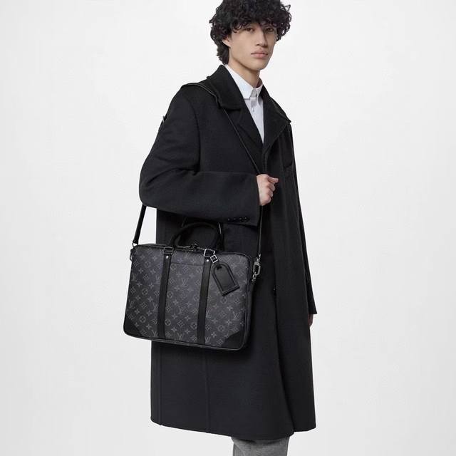 M46457 Black Flower This Voyage small briefcase is made of Monogram Eclipse canv