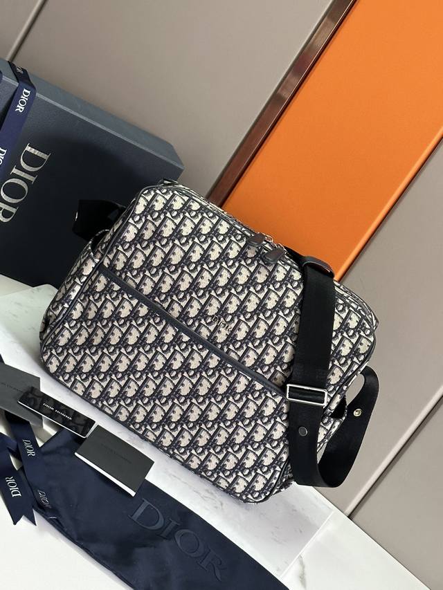 New Dio.R Baby Bag Made from signature Oblique print canvas, this baby changing