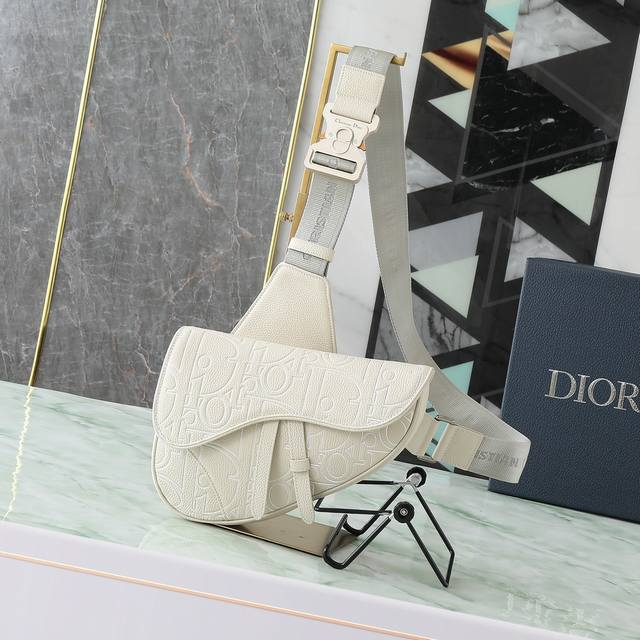 This saddle bag is stylish and classic. Crafted from materials such as beige Dio