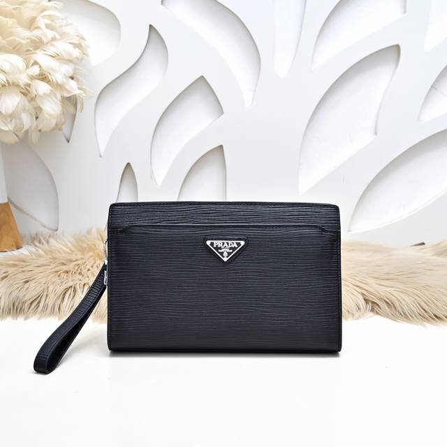 Prada-Prada's latest men's clutch is made of imported calfskin leather. It feels