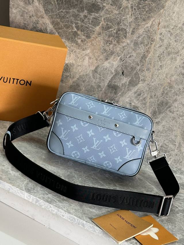 Model: M14073 Light Blue This Alpha messenger bag is rendered in bright colors o