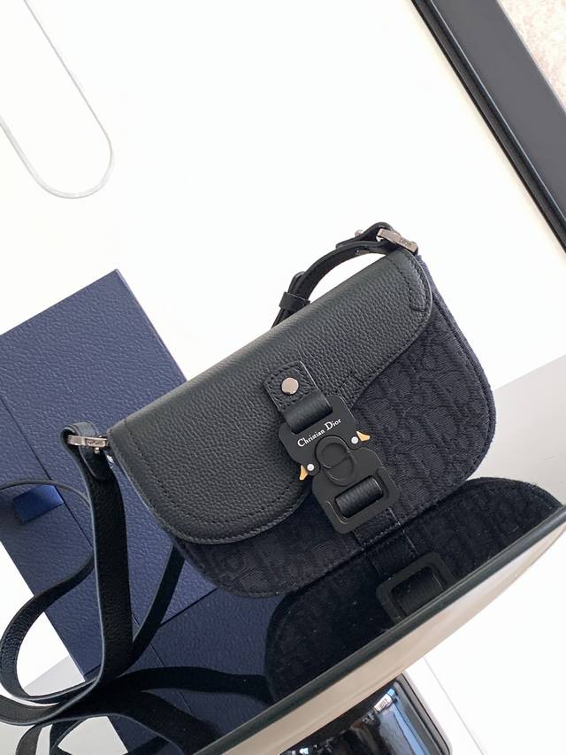 A new addition to the Spring 2023 Men's Collection, this Saddle Clutch with Shou