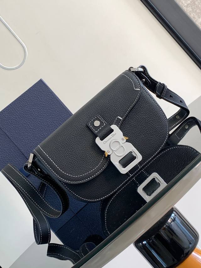 A new addition to the Spring 2023 Men's Collection, this Saddle Clutch with Shou