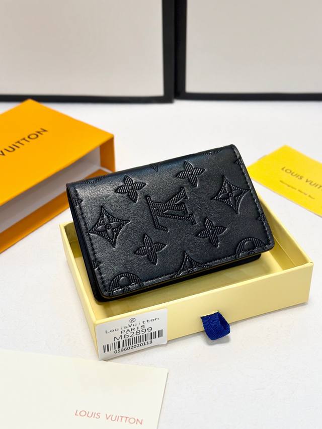 Black Coin Card Holder Made from Louis Vuitton's iconic black Taiga leather, the