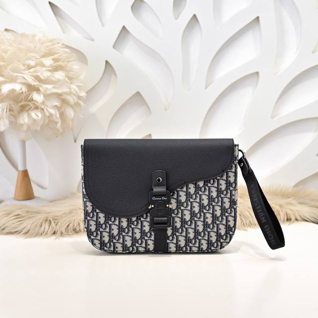 Dior - Dior's latest clutch, available on the official website. This saddle clut