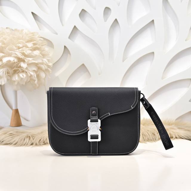 Dior - Dior's latest clutch bag, available on the official website. This saddle