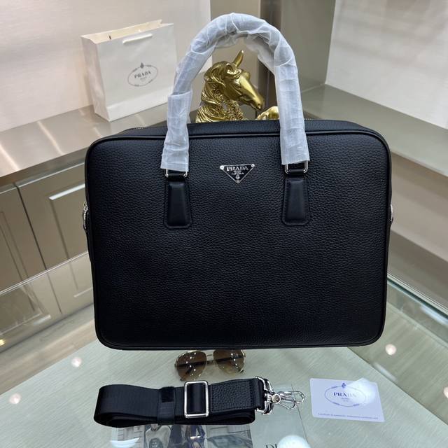 Prada's new briefcase is made of imported tumbled cowhide, top-grade polished st