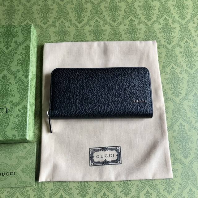Top-of-the-line Gucci logo zip-around wallet. Men's collection of everyday acces