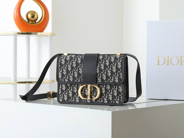 The 30 Montaigne bag is crafted in blue Oblique print fabric, with a timeless an