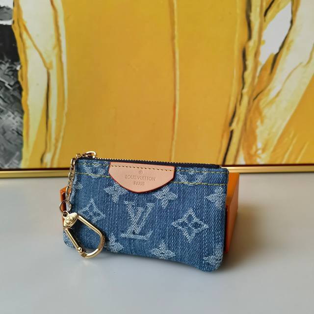 Color Blue Size 12X7X1.5 Denim The "Pochette Cle Card Key Holder" is made of sto
