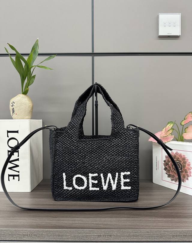 LowThe new Small Raffia Font Tote is a rectangular bag with a contrasting Loe*We