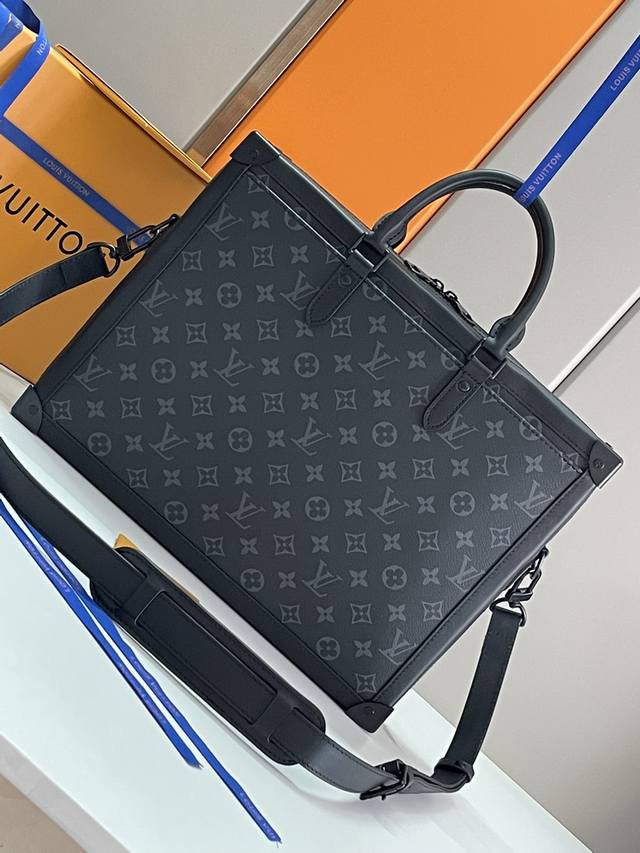 Top-grade original 44952 Soft Trunk briefcase is shaped in Monogram Eclipse canv