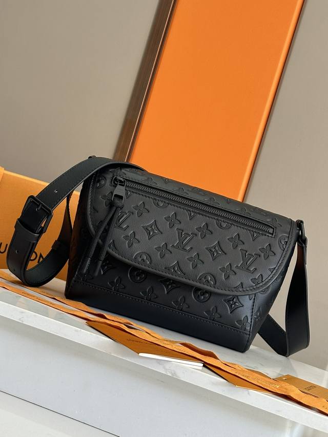 Ulse Messenger Bag M12681 Embossed Leather This Ulse Messenger Bag is crafted in