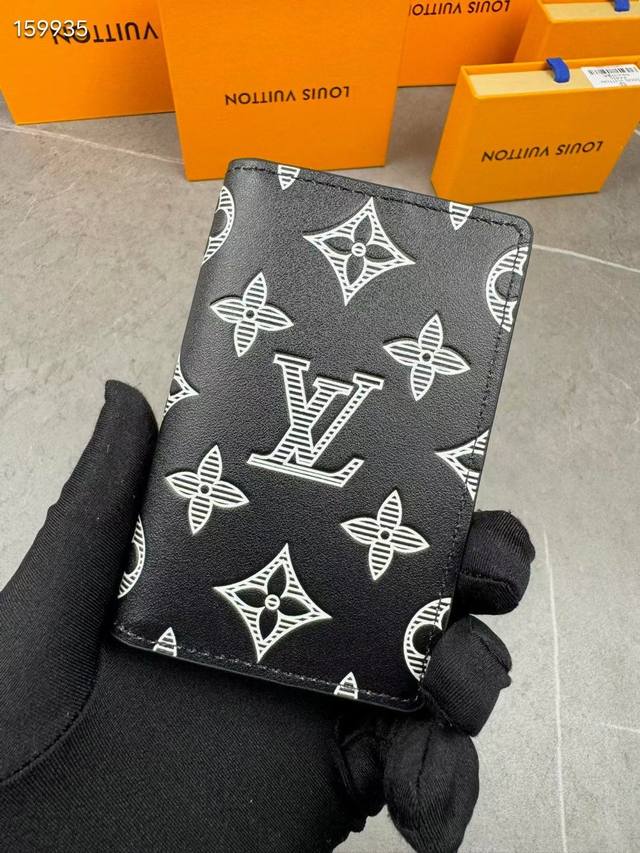 M83378 This pocket wallet is made of soft Monogram Shadow cowhide leather and ha