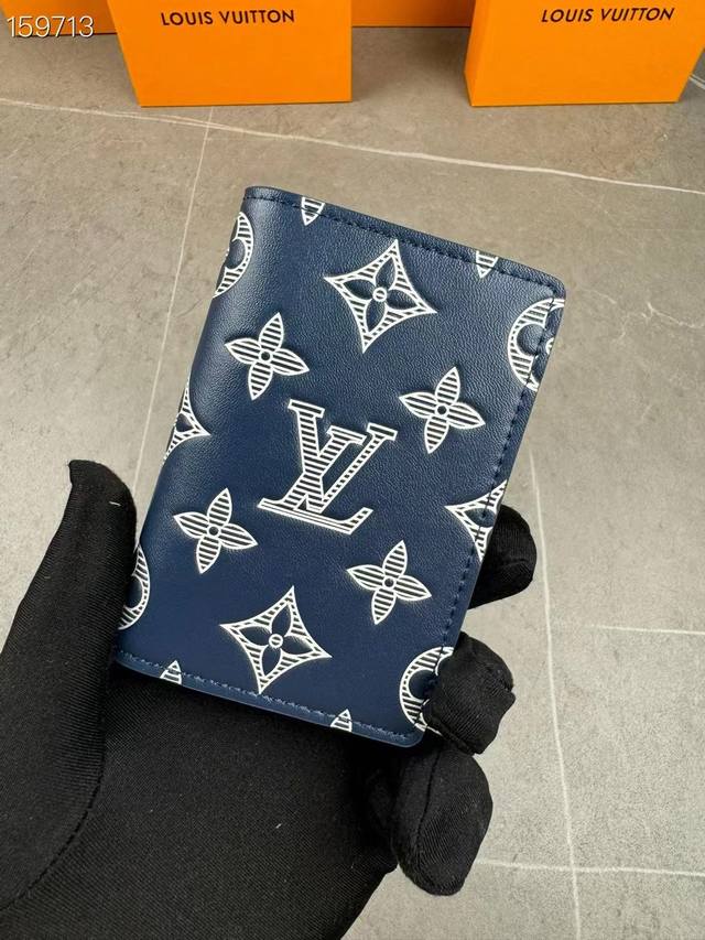 M83378 This pocket wallet is made of soft Monogram Shadow cowhide leather and ha